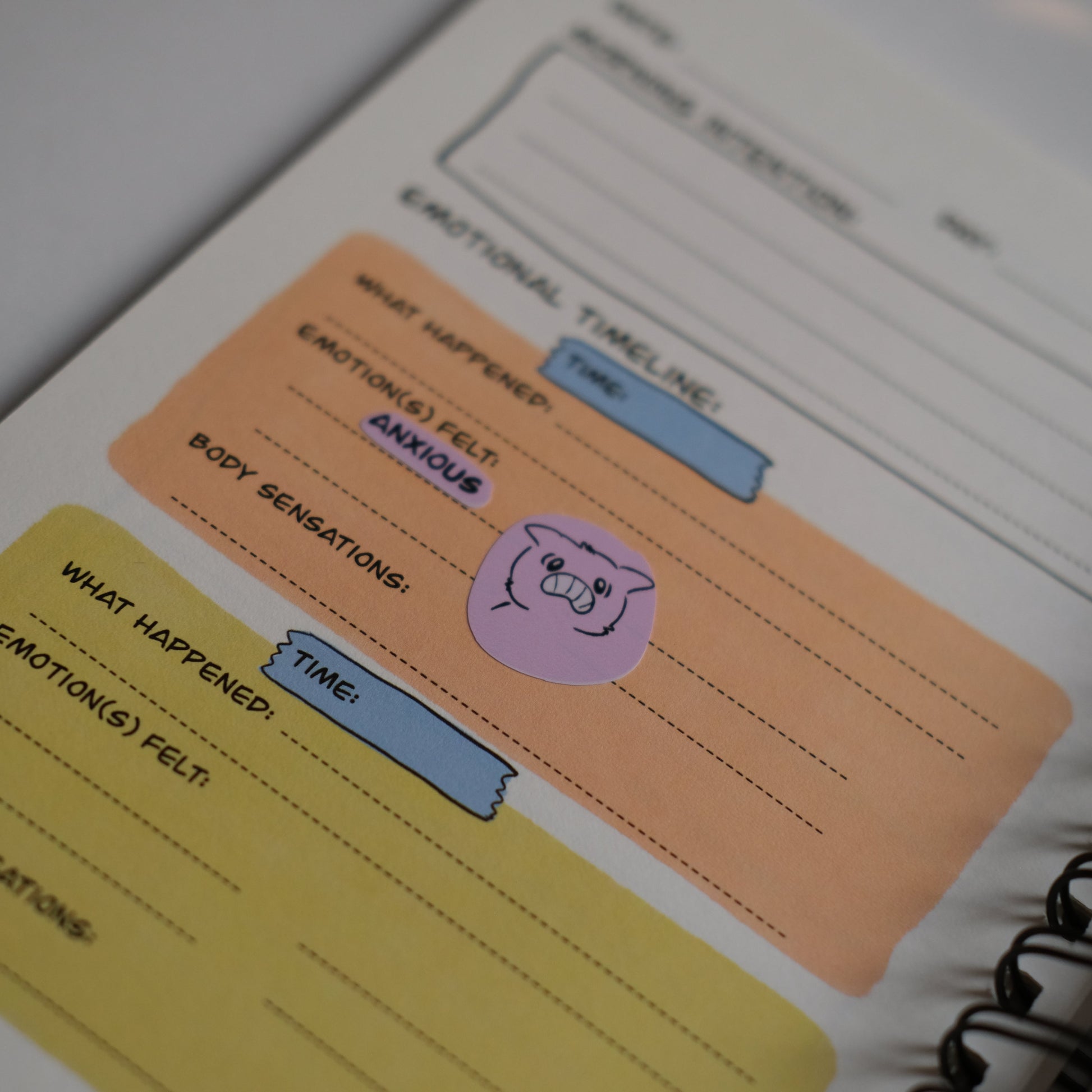 Notebook with colorful sticky notes on a plain background
