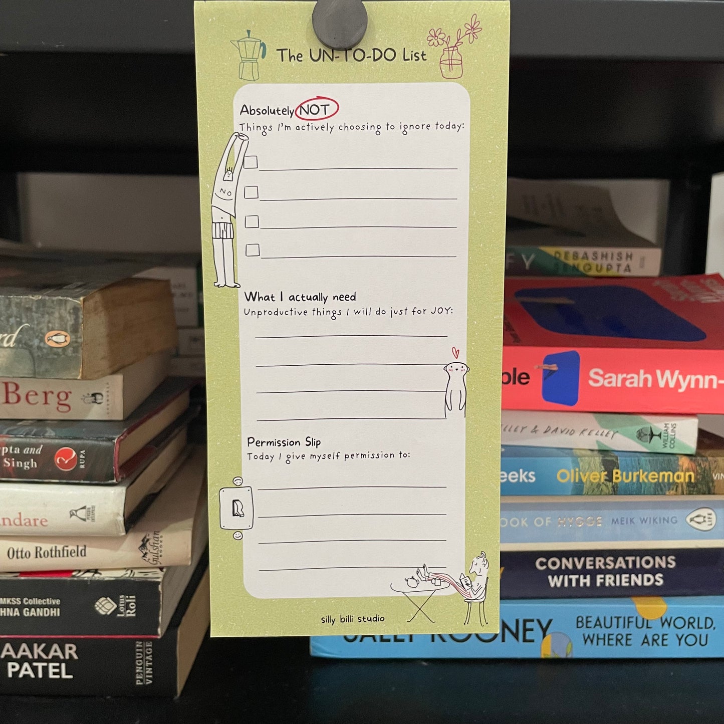 Notebook with a to-do list on top of books