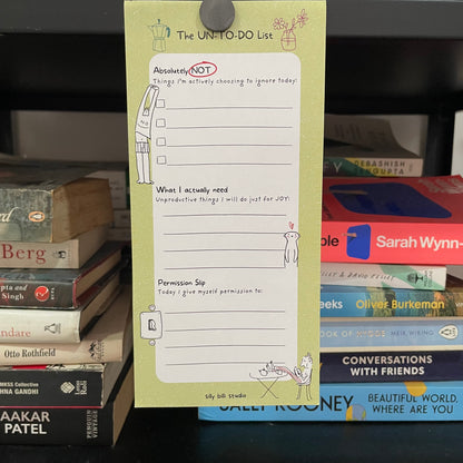 Notebook with a to-do list on top of books